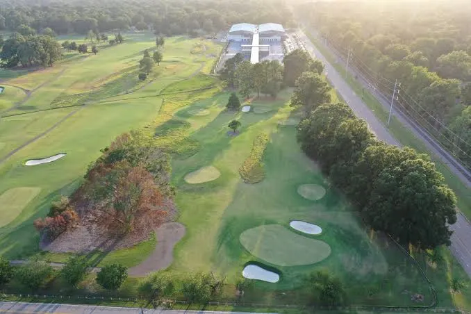 Aerial view of the course and new clubhouse beside the road
