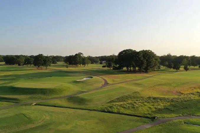 Rolling fairways and bunkers in low sun