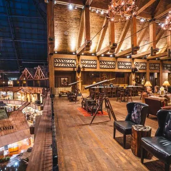 Leather wingback chairs on the lobby mezzanine, the Pyramid's steel frame beyond