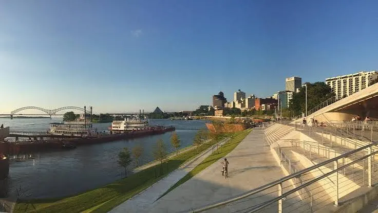 The riverside promenade and steps toward the skyline