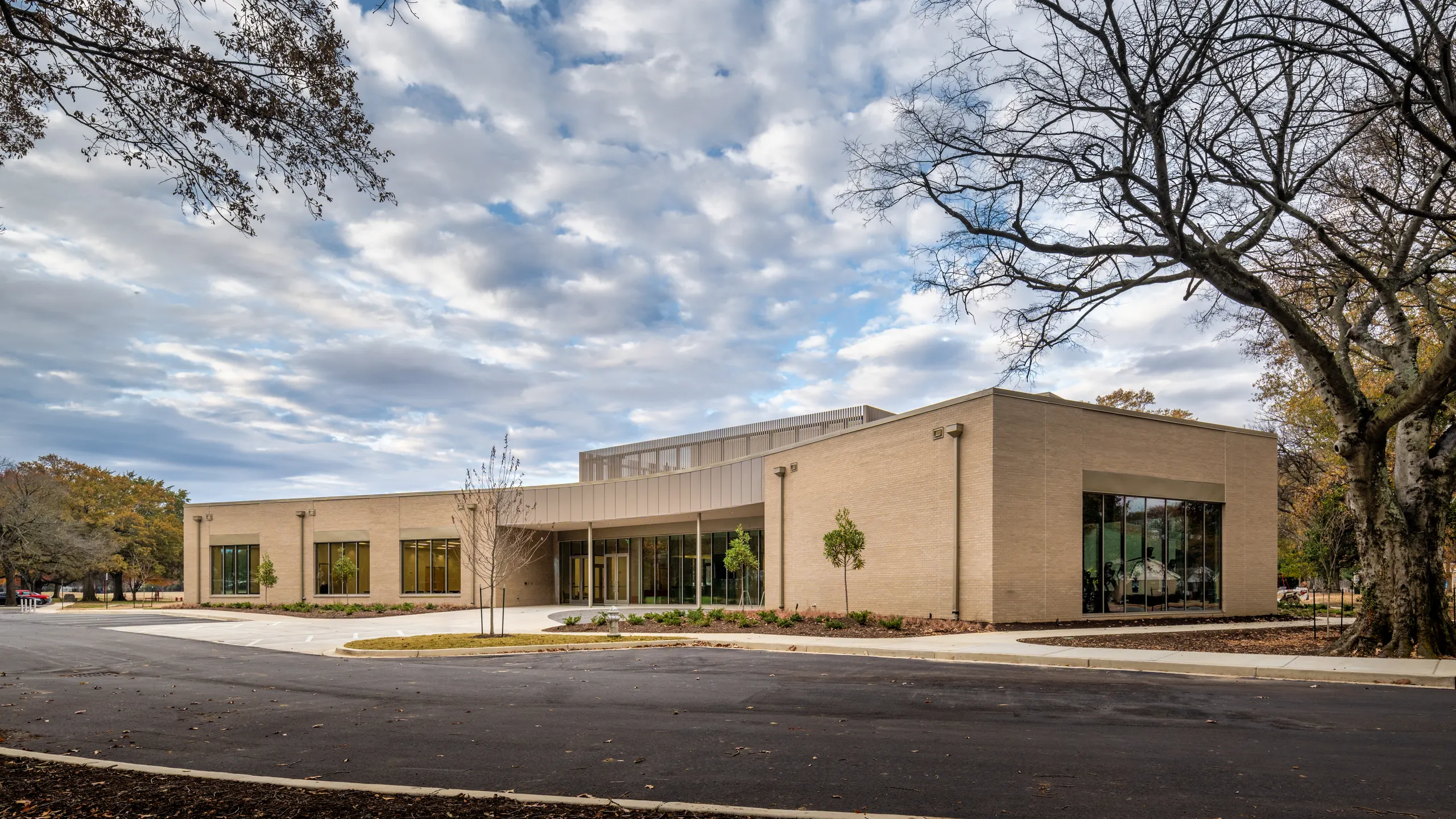 The center's long front under a cloudy sky
