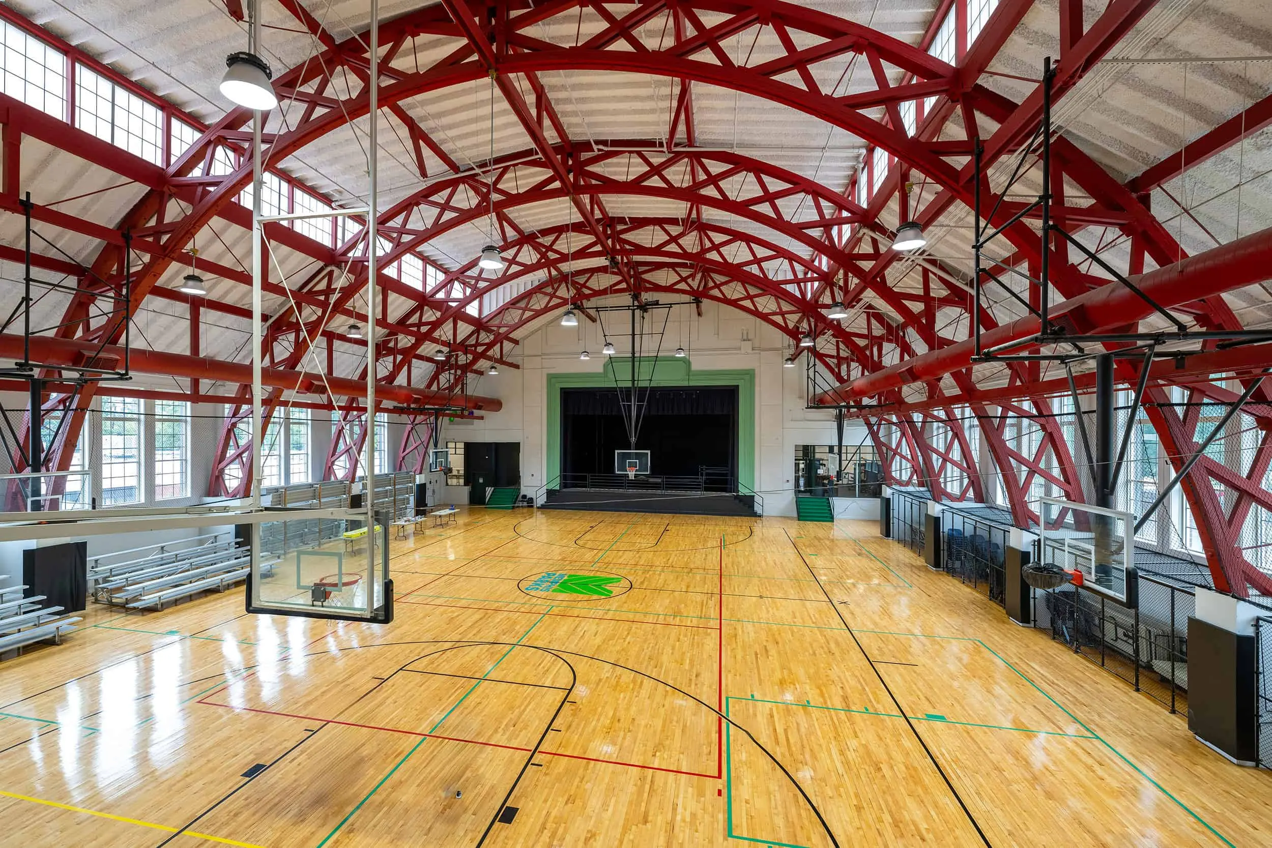 The gymnasium under red steel arches