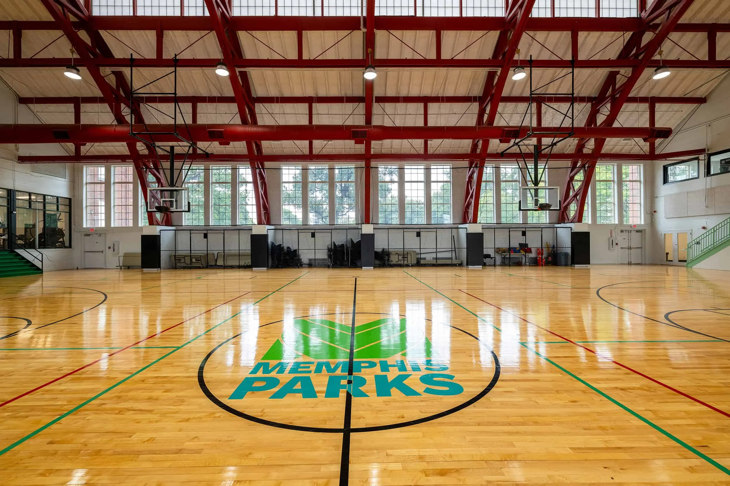 The gym floor with the Memphis Parks mark at center court
