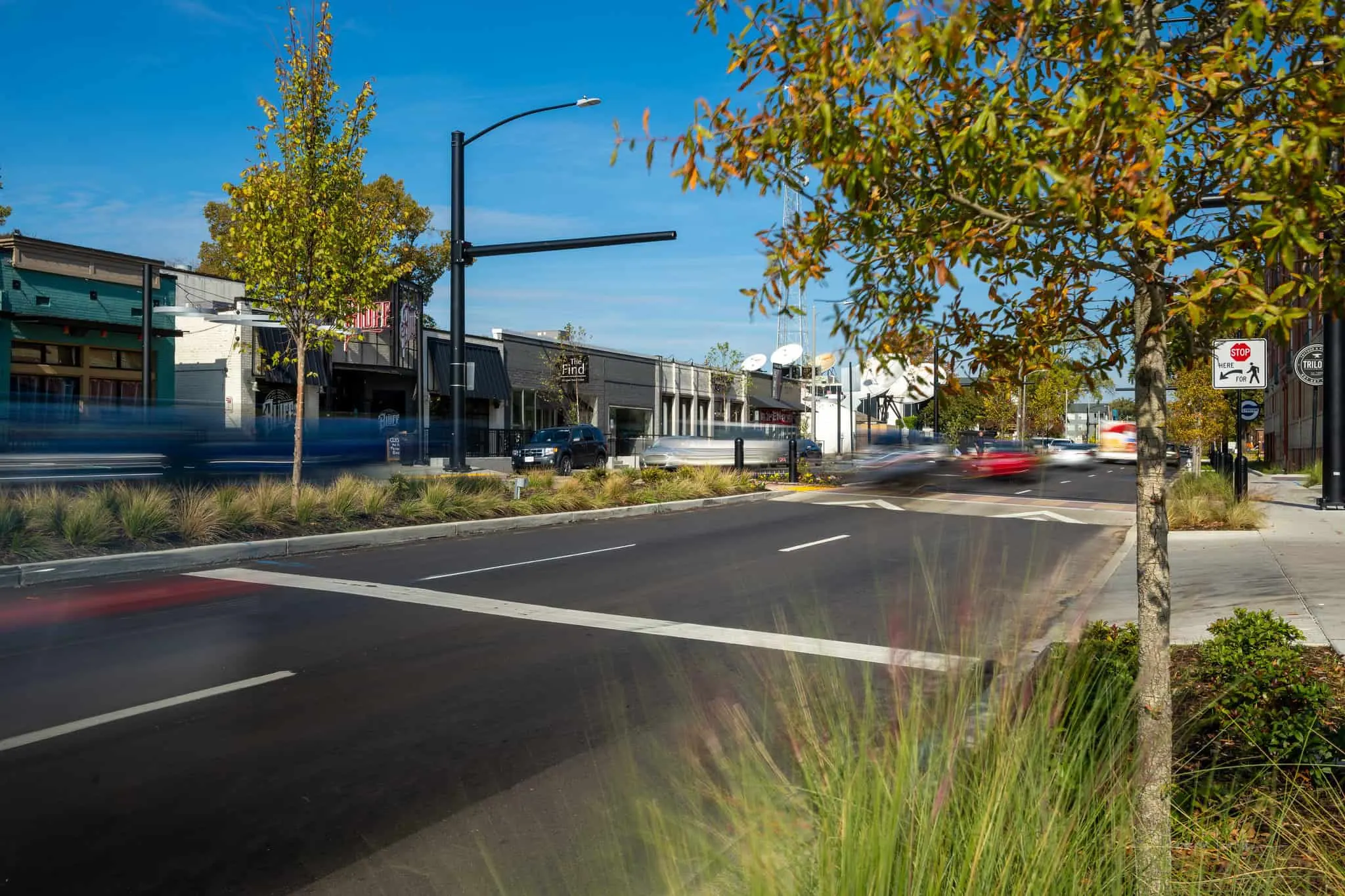 Street trees and lighting at a Highland corner