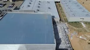 Aerial view of the new roof going on