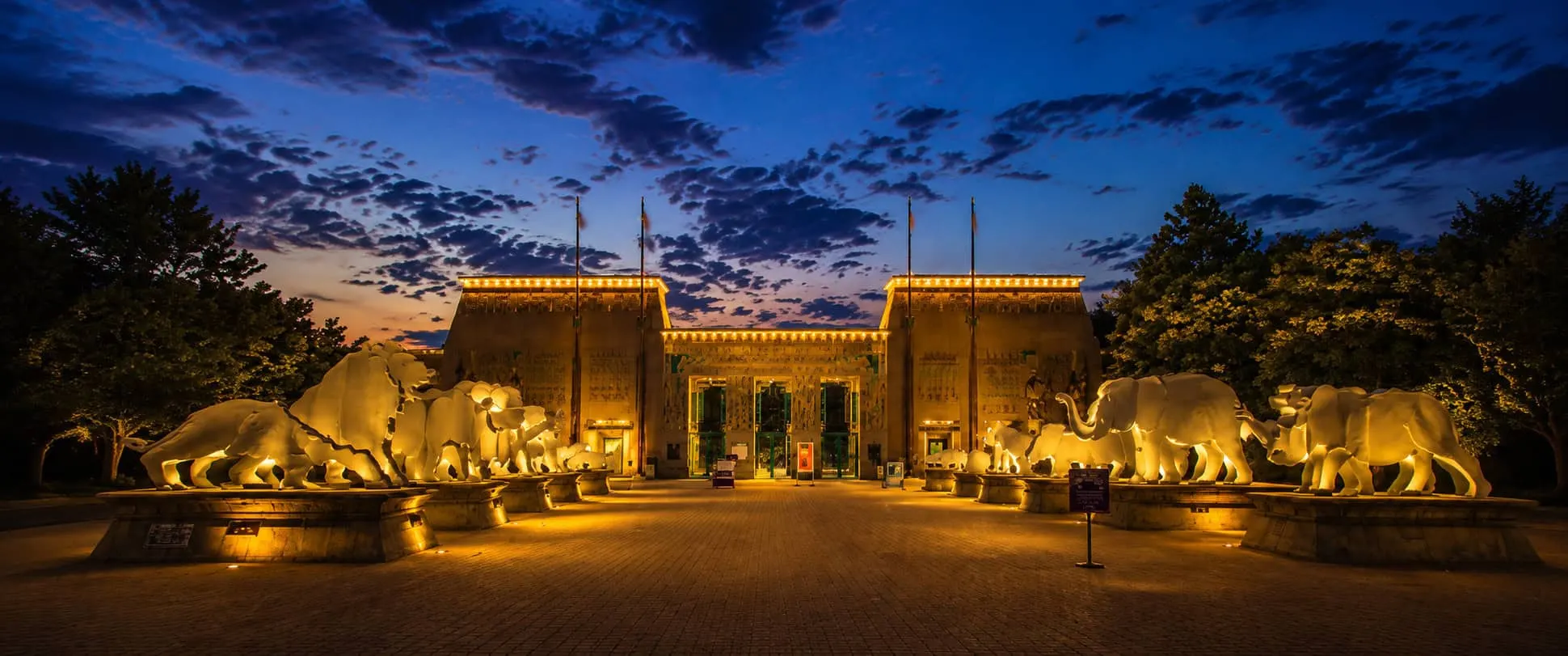The zoo's Egyptian-style entrance lit at dusk