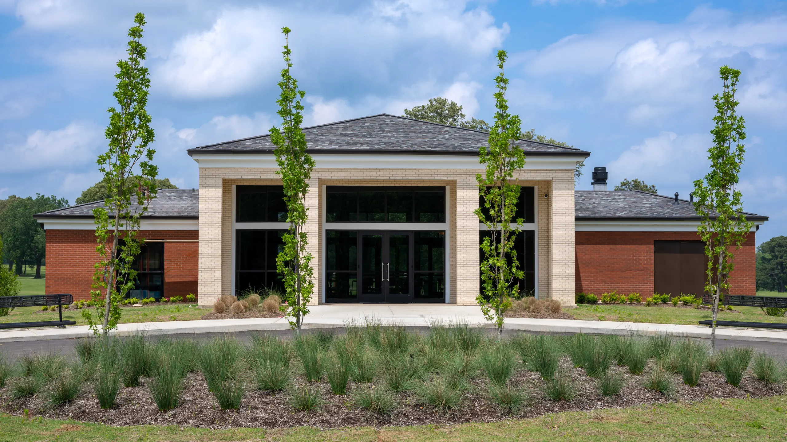 The clubhouse entrance portico behind a planted circle