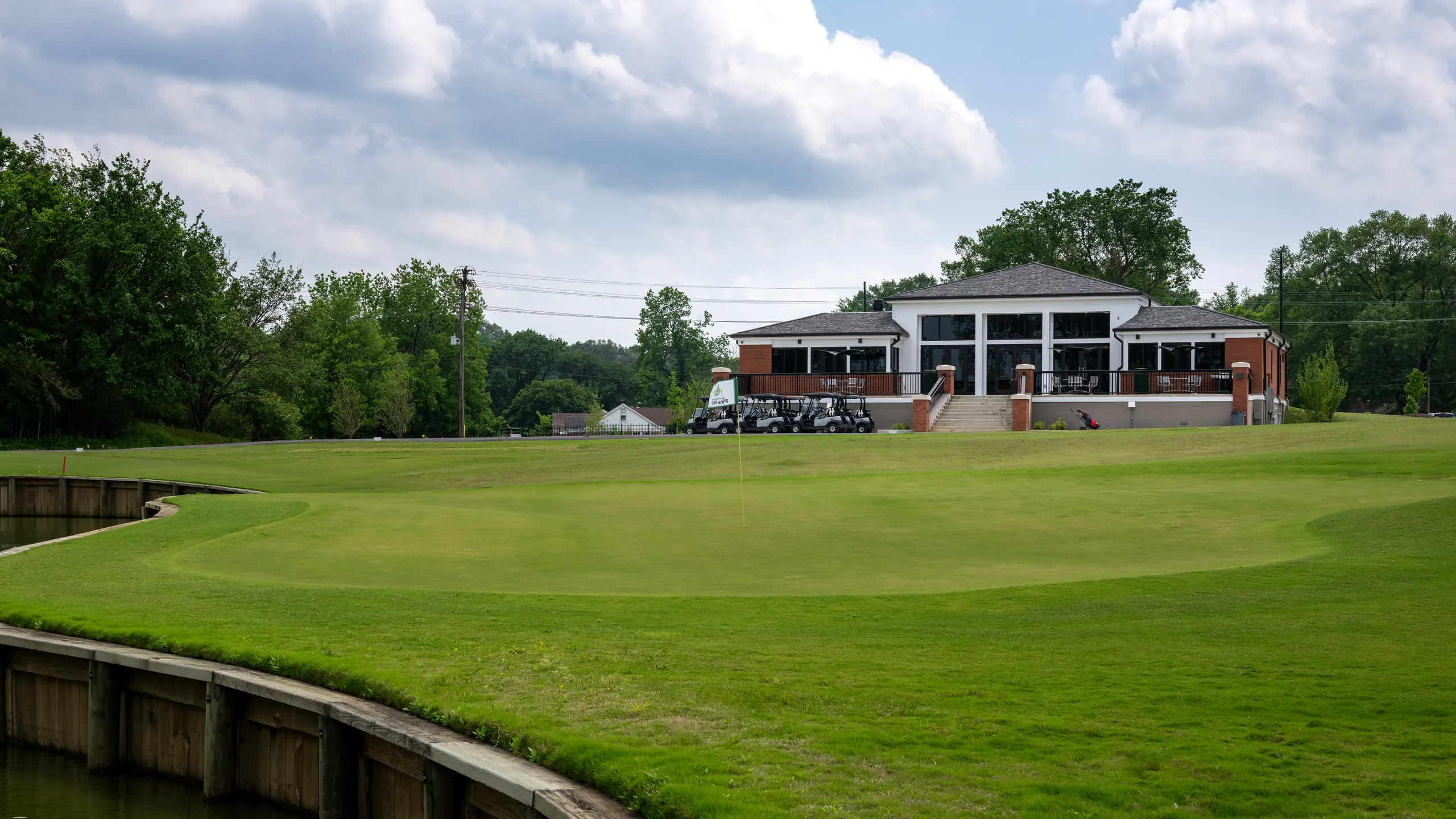 The clubhouse seen from a green edged in timber