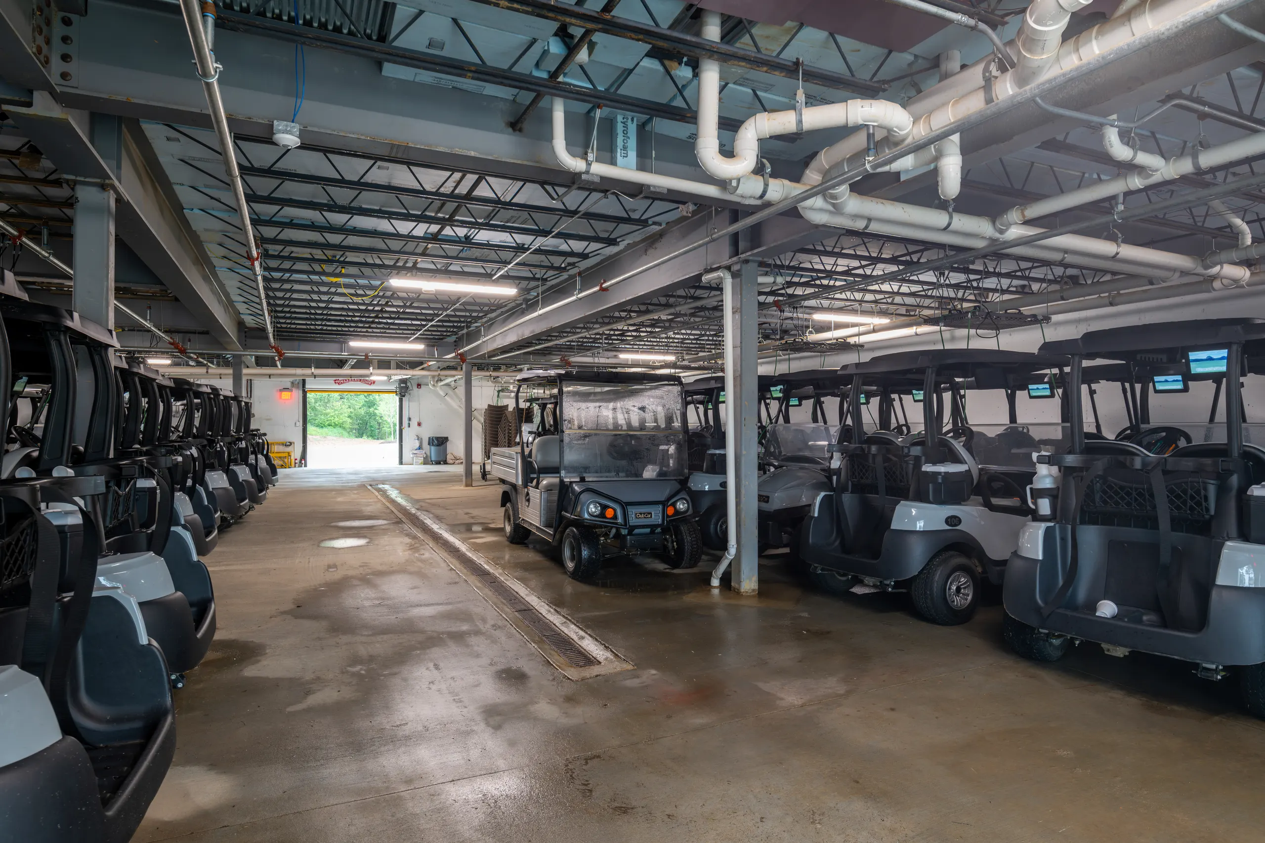 The cart barn, with rows of carts under exposed ductwork