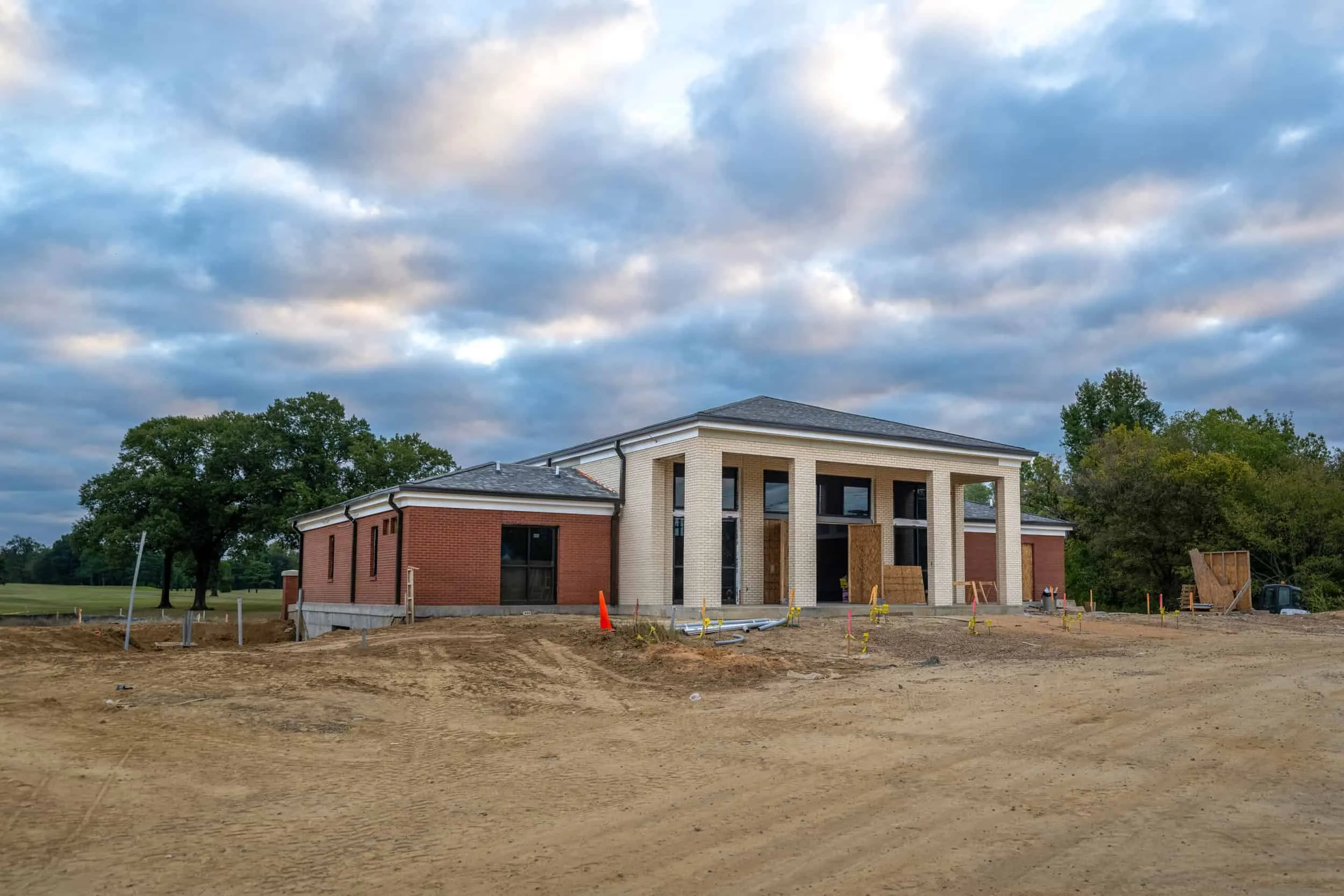 The clubhouse during construction, its portico in place