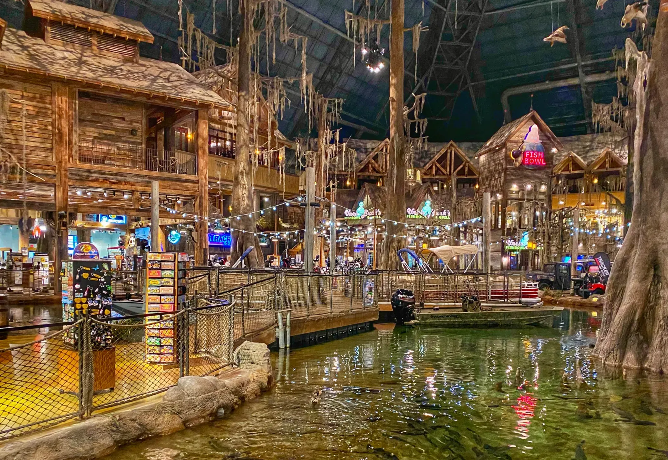Timber storefronts and cabins along the swamp's edge, the Pyramid's steel frame overhead