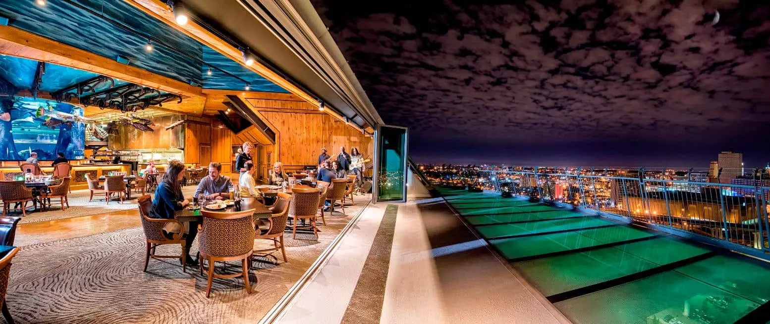 The apex restaurant at night, its illuminated glass observation floor cantilevered over the Memphis skyline