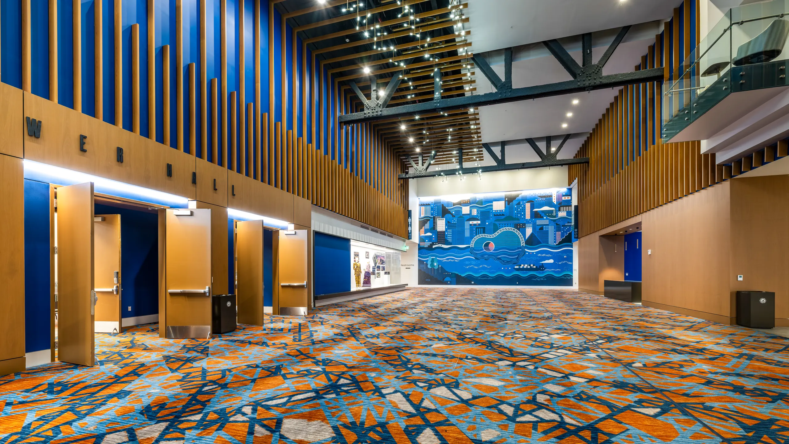 The prefunction hall under a ceiling of hanging lights
