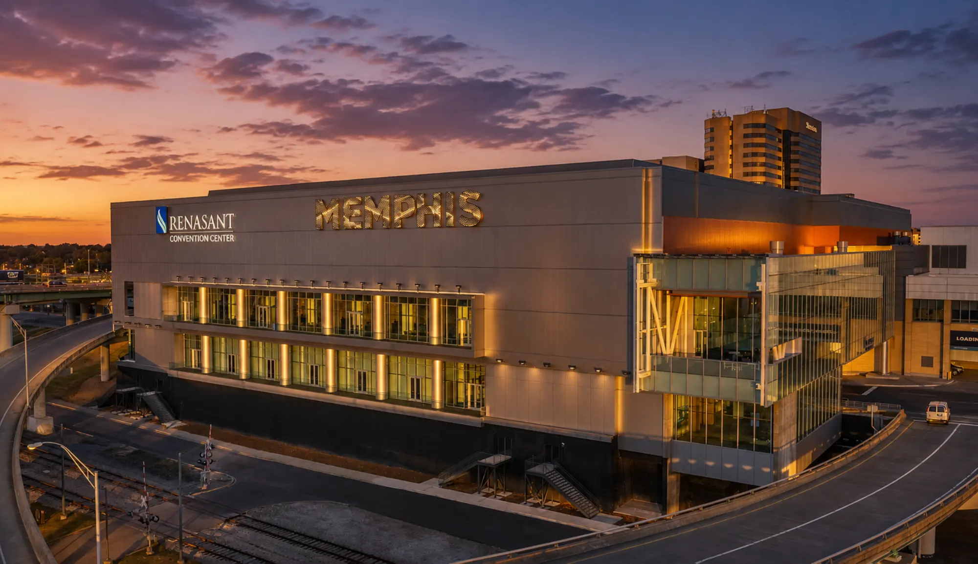 The center at sunset, the glass corner and the MEMPHIS letters glowing