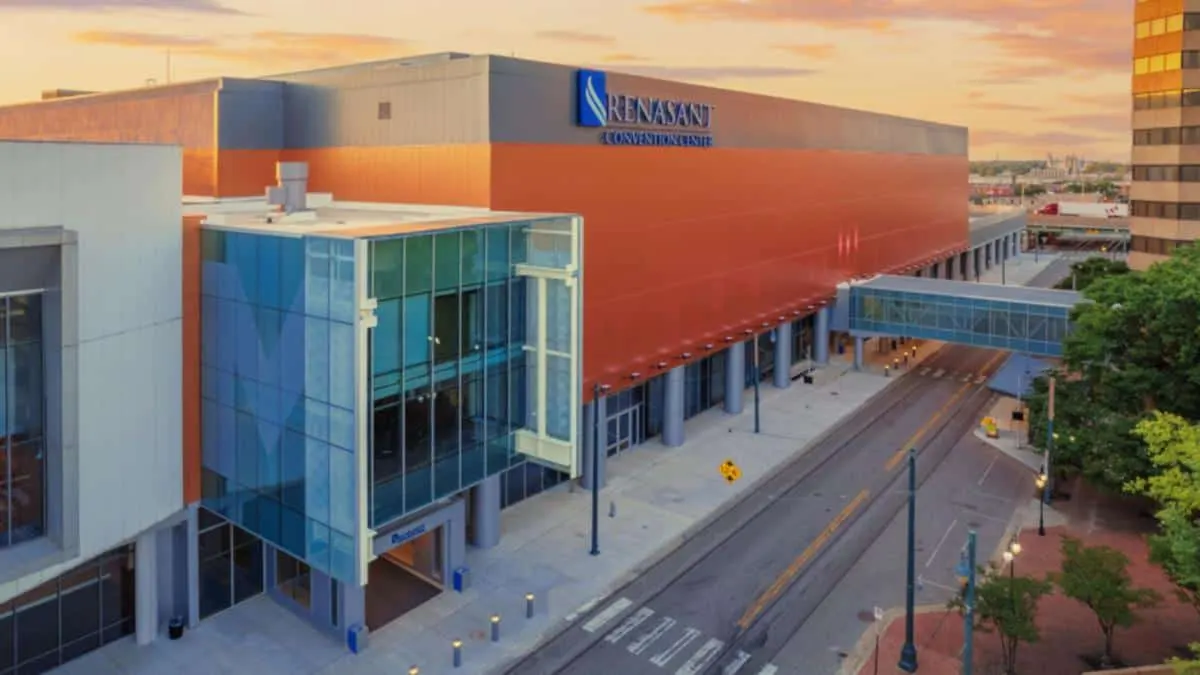 Aerial view of the center's red and glass facade