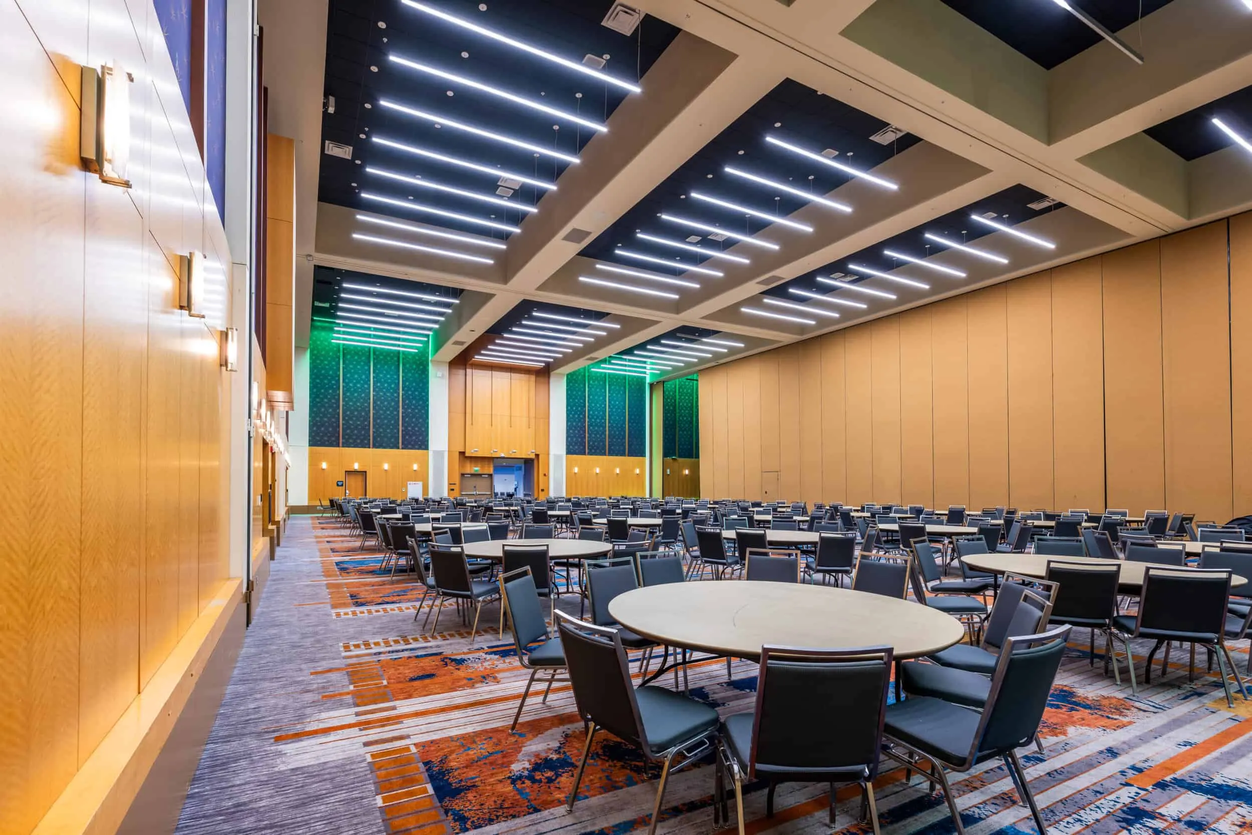 A ballroom set with round tables