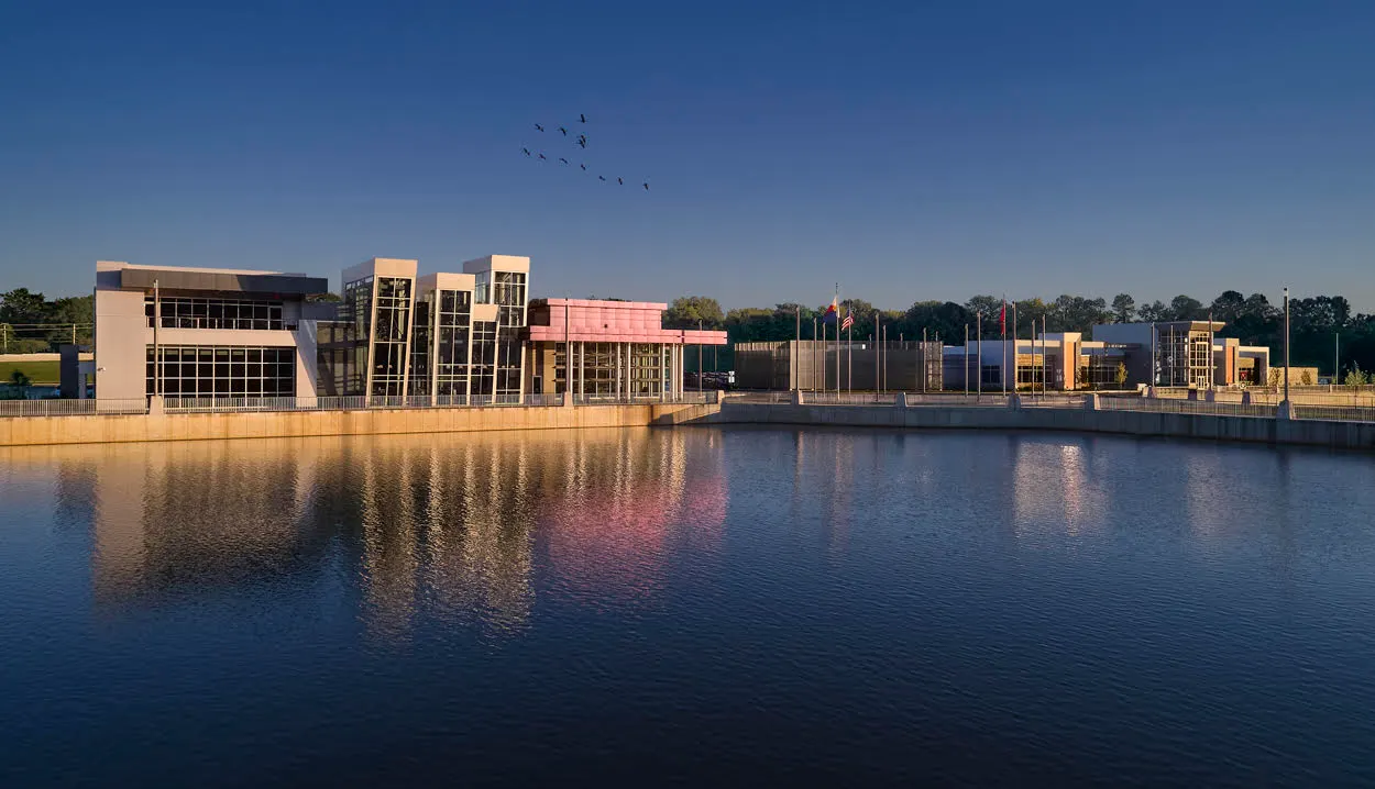 The civic center and library across the lake at dusk