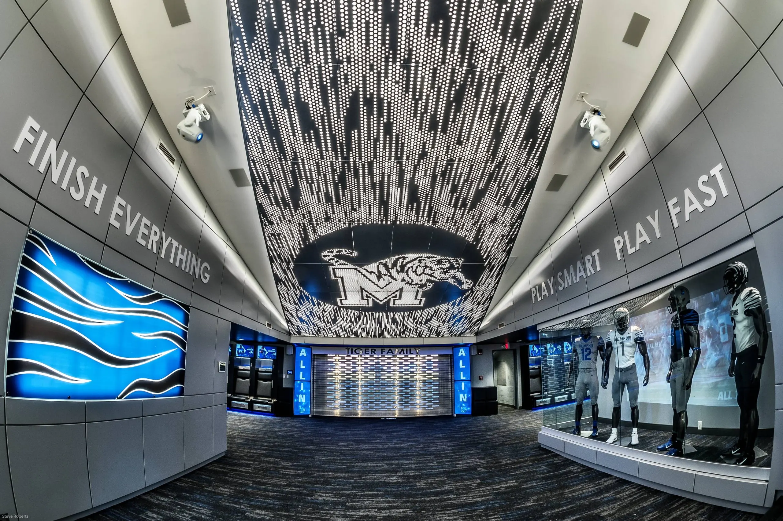 The locker room's central space under the Tigers crest in the ceiling