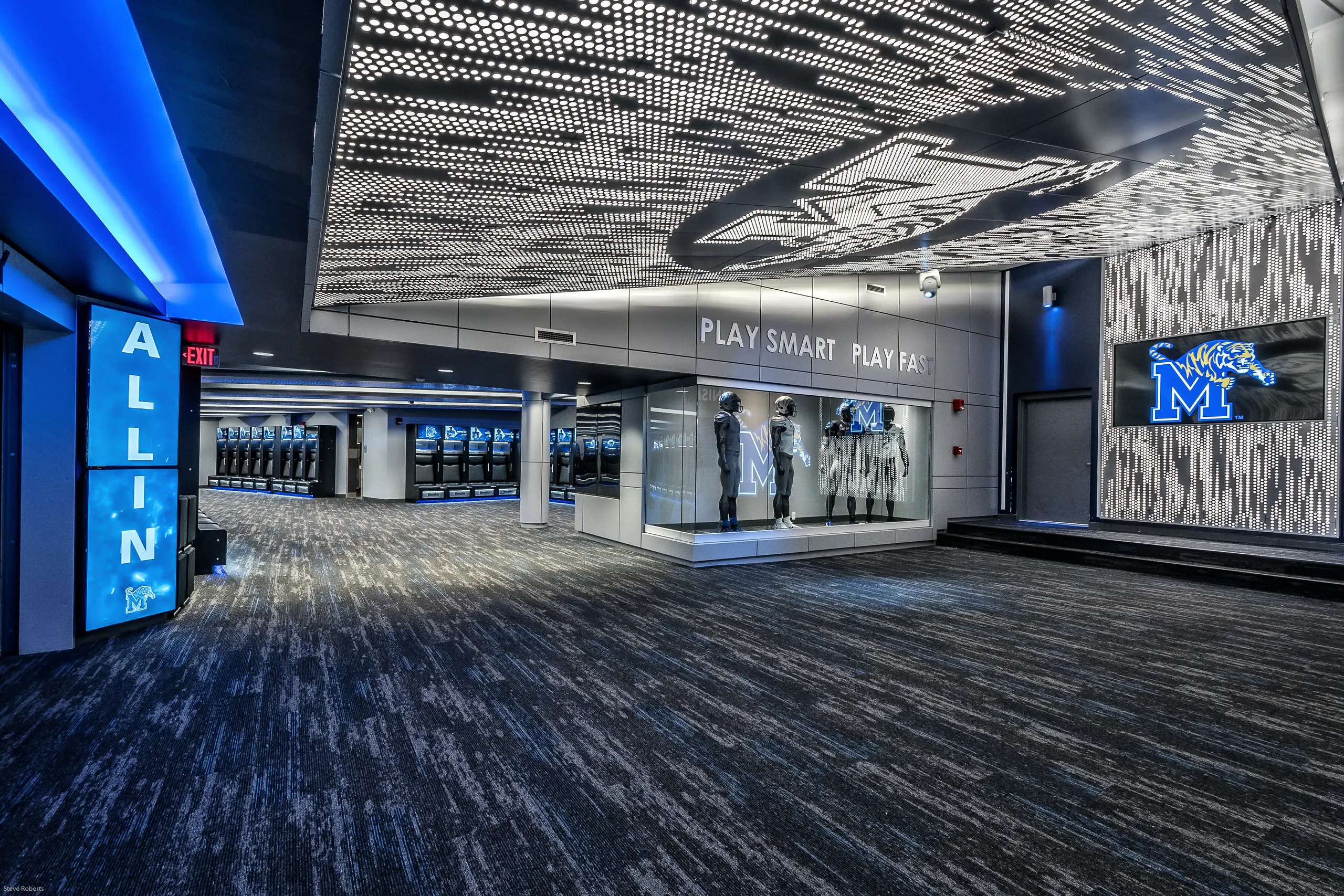 The wide view under the ceiling crest, the display case and lockers beyond